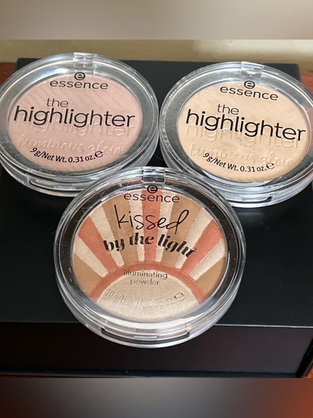 Essence kissed by the light illuminating powder star kissed and 2 highlters